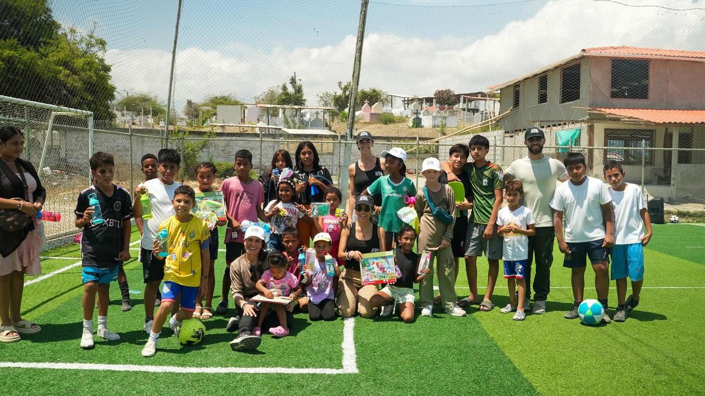 Kids and volunteers on the soccer field