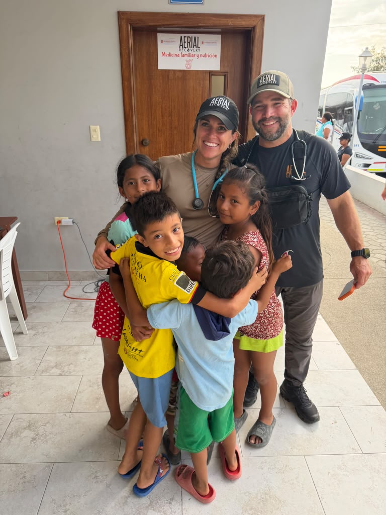 Aerial Recovery mission team outside the clinic in Canoa