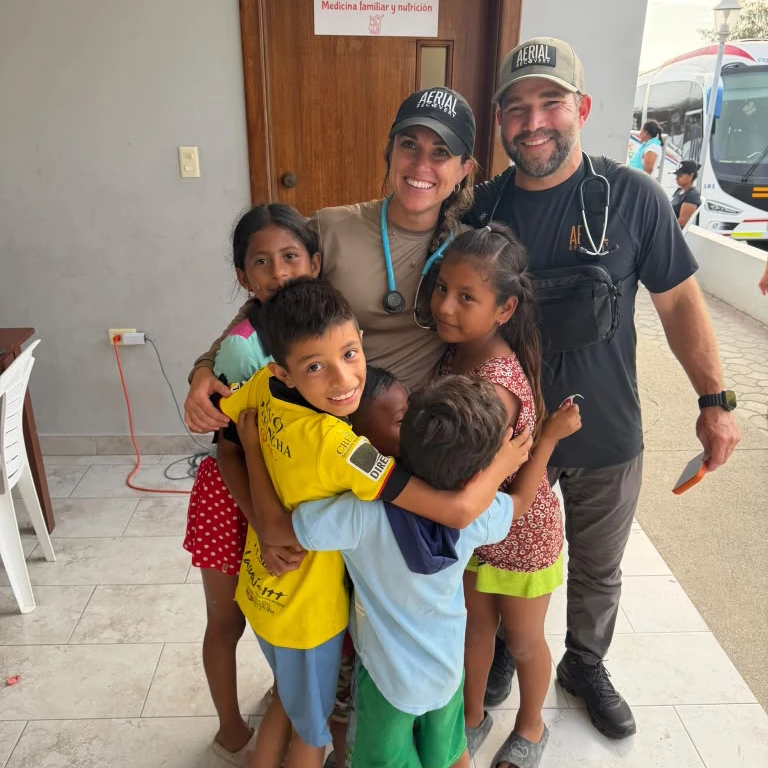 Aerial Recovery mission team outside the clinic in Canoa