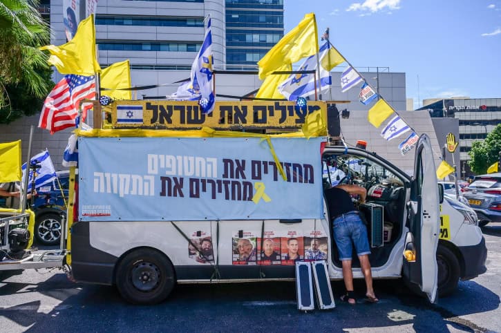 Hostages' families burst through Gaza fence during border protest