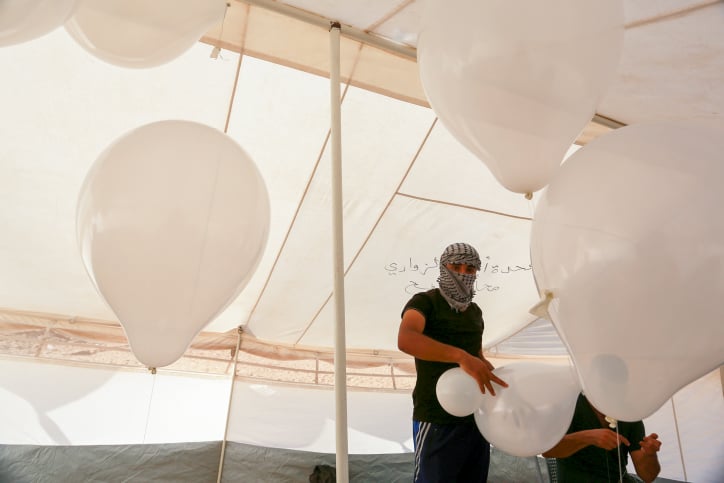 IDF aircraft strikes groups of Gazans launching incendiary balloons towards border