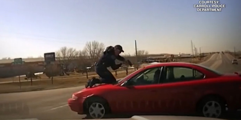 WATCH: Dramatic Video Shows Police Officer Clinging To Car Hood During Chase