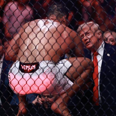 UFC fighter Paulo Costa jumps out of cage to greet Trump at match