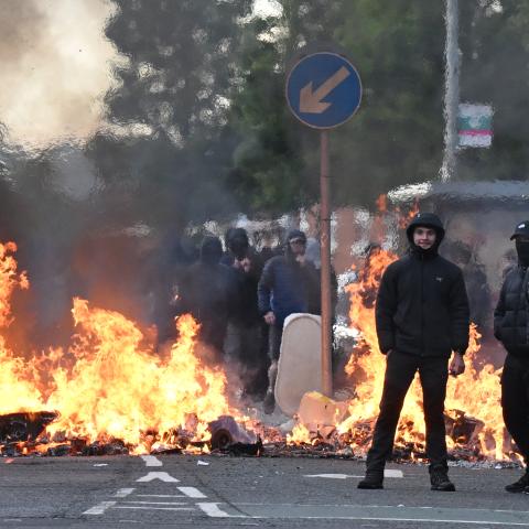 Police in Belfast blast immigration protestors with water cannons