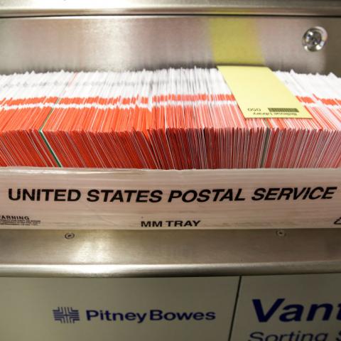 Postal service ceased work on computer system for Trump's election security measure, official says