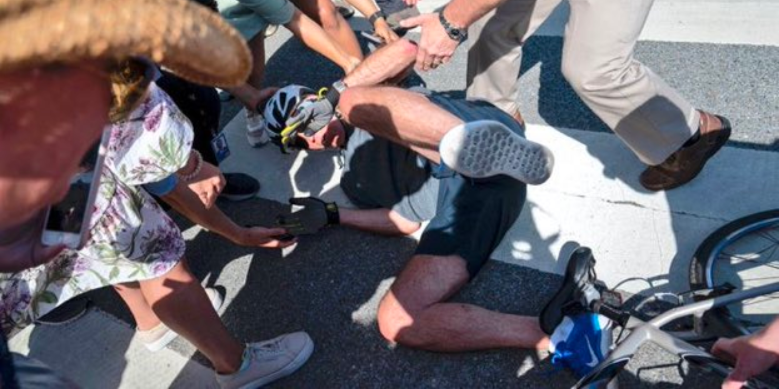 BREAKING: Biden falls off bicycle in front of crowd of onlookers