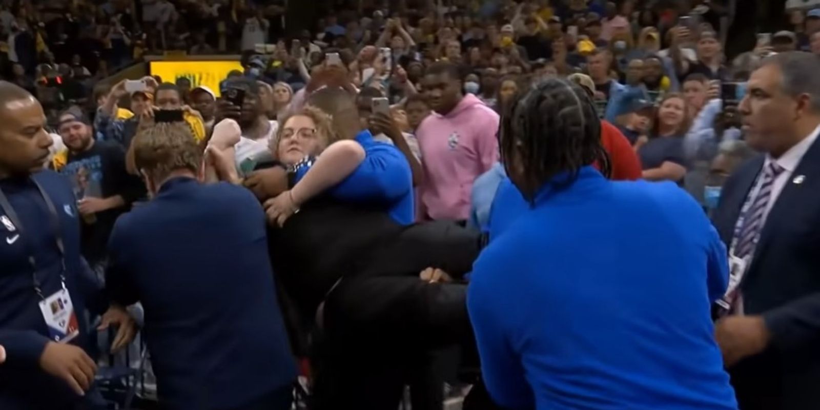 WATCH: Animal rights activist chains herself to basket stanchion during Timberwolves game