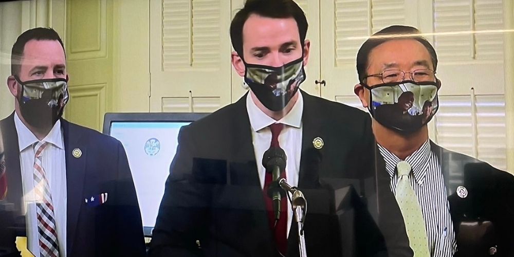 California GOP wear masks of maskless Gov Newsom and Magic Johnson