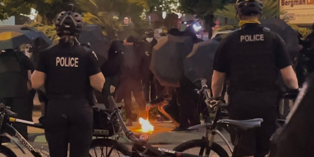 Antifa chants 'death to America,' burns American flag to protest law enforcement appreciation dinner in Washington