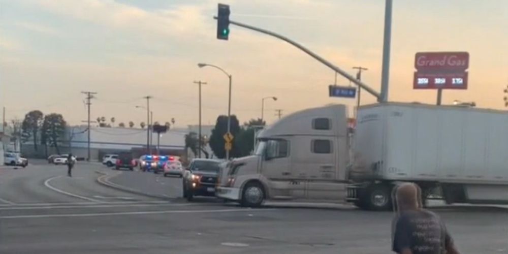 WATCH: Semi-truck driver plows into murder suspect to end police chase
