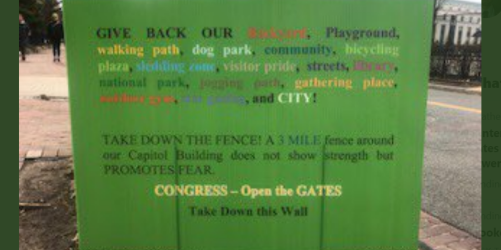 D.C. residents start putting up signs around Biden's wall surrounding the Capitol, 'Give Back Our City!'