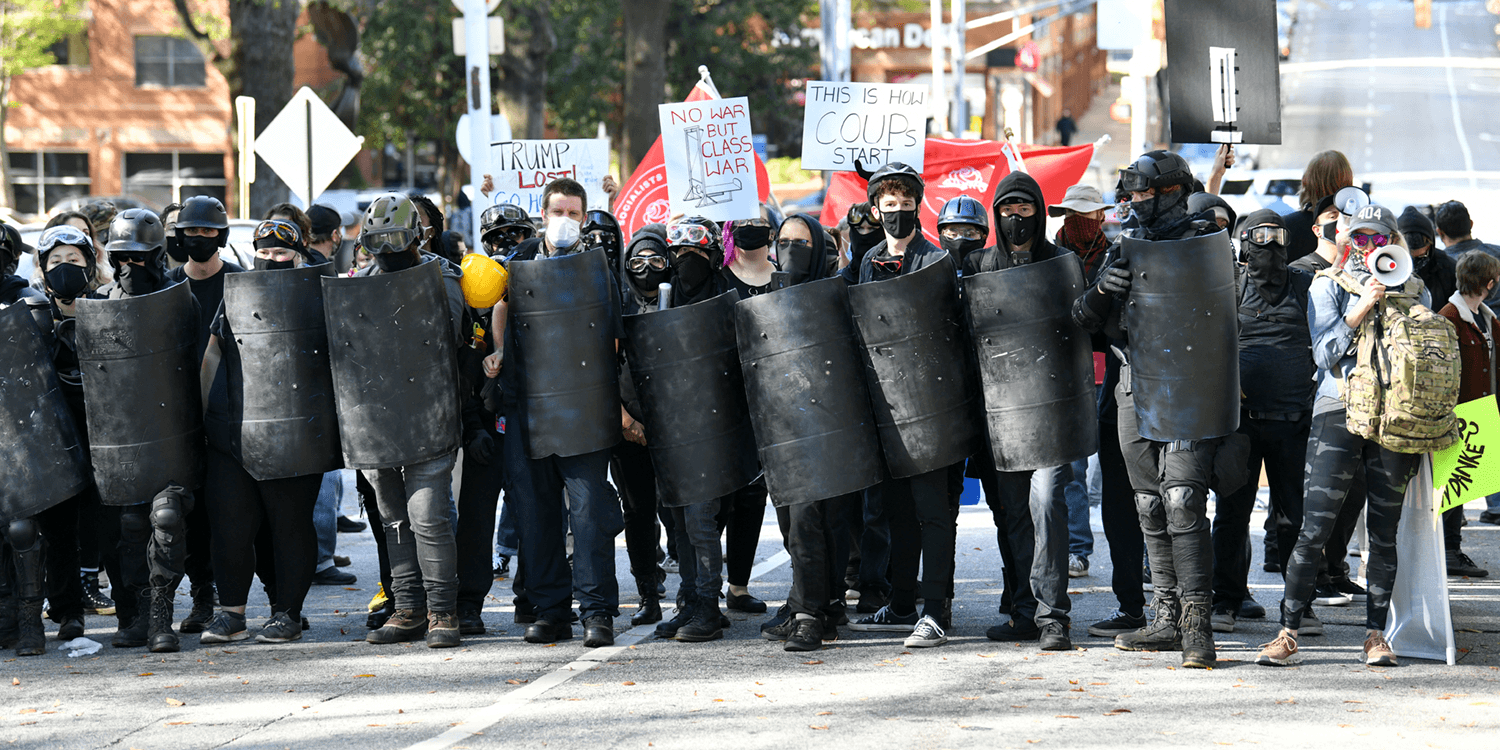 Riot police intervene as tensions rise between Trump supporters and ...
