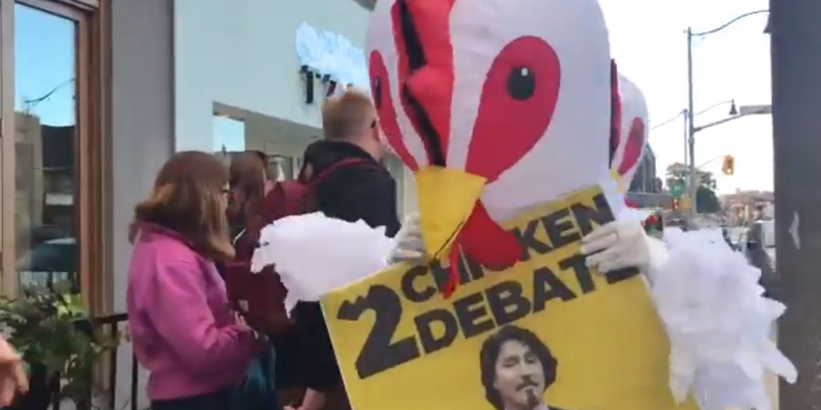 Protestors dressed as chickens confront Trudeau for “chickening” out of debate