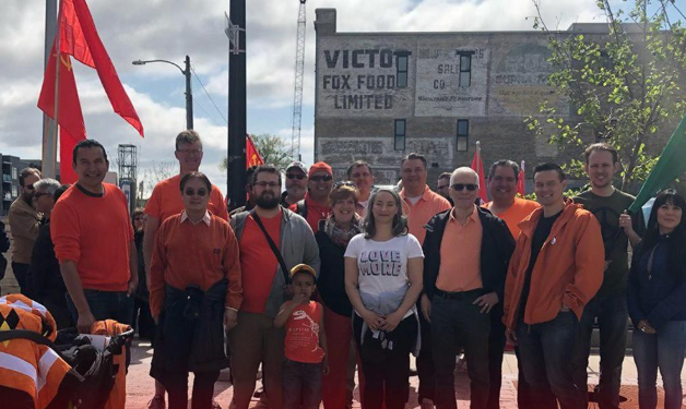 Manitoba NDP Leader seen posing with Soviet flag