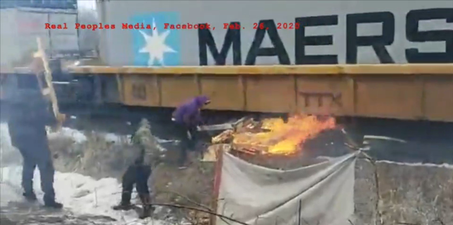 WATCH: Anti-pipeline protestors try to light train on FIRE