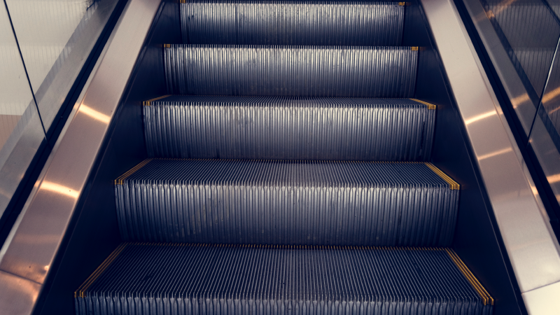 Photos: Woman Trips Over Luggage, Gets Leg Stuck in Airport Escalator - They Had to Amputate to Free Her