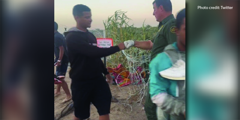 Photo of Border Patrol Agent 'Fist-Bumping' An Illegal Migrant Crossing the Border Infuriates Americans